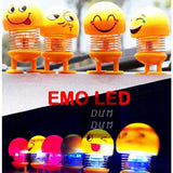 Dancing emoji dashboard doll with LED light.