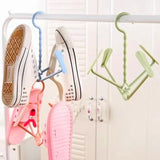 Rotating shoe rack with four hooks, portable, dual-use for wet and dry shoes.