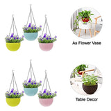 Decorative hanging flower pots with chains.