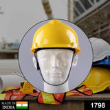 Bright yellow construction helmet, made of sturdy plastic for safety.