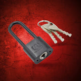 Black metal padlock with key, secure locking.