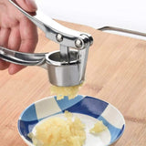 Garlic press with stainless steel construction and ergonomic handle