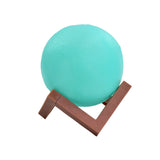 Wooden stand moon lamp with a blue light for bedroom ambiance.