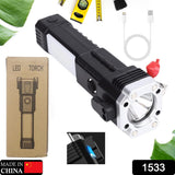 Portable LED torch with hammer and magnets, ideal for outdoor use.