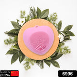 Silicone facial scrubber with heart shape, perfect for exfoliating skin